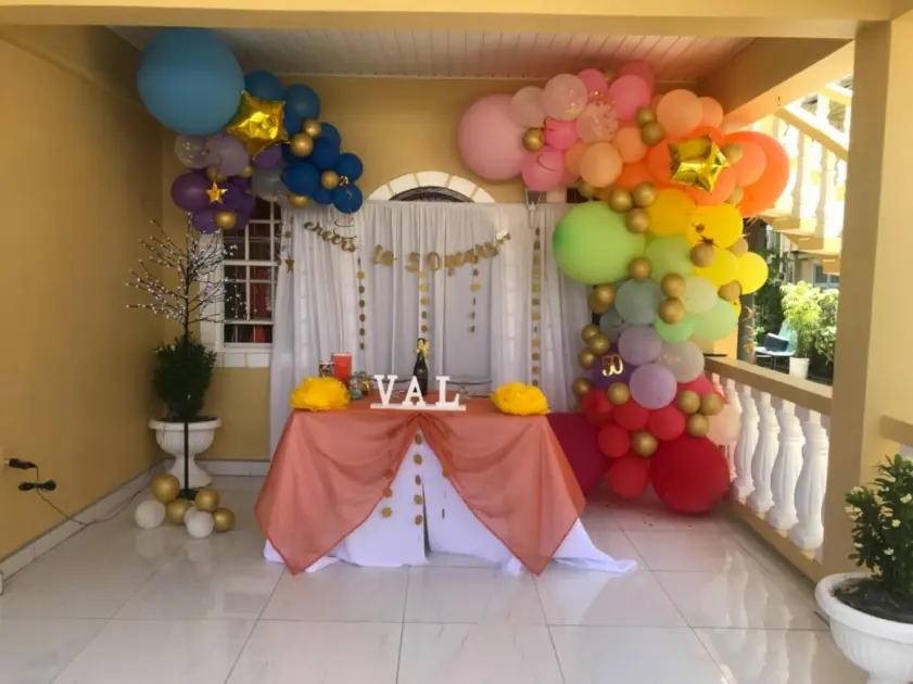 party balloons arch and white backdrop