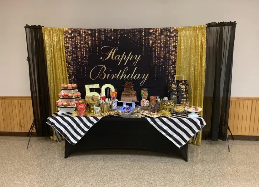 bday backdrop black food table