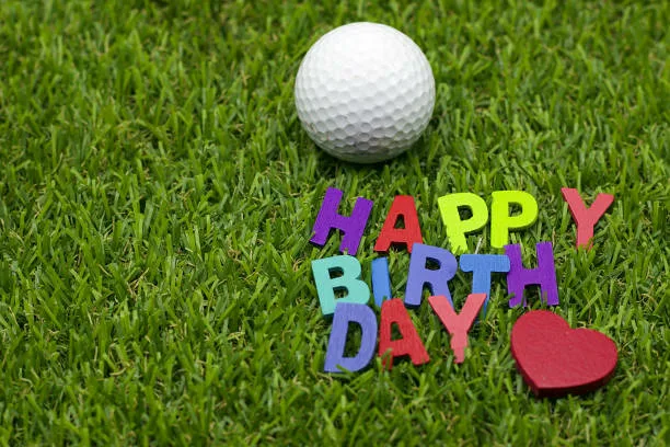 Happy Birthday Wording With Bear And Golf Ball Are On Green Grass