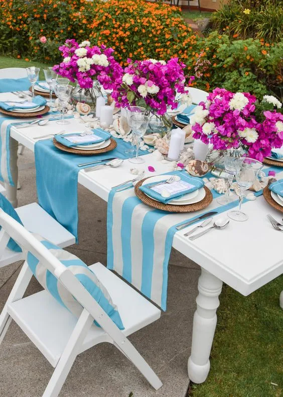 Mamma Mia Birthday Party Outdoor Table Setup With Flower Centerpiece