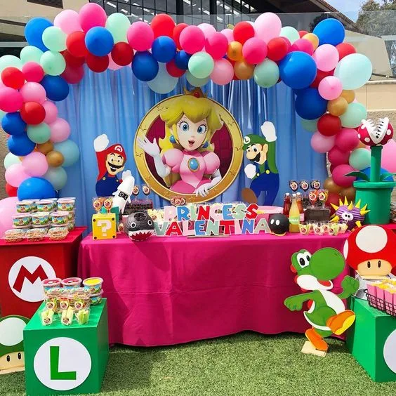 Princess Peach Birthday Outdoor Table Setup With Balloon Arch