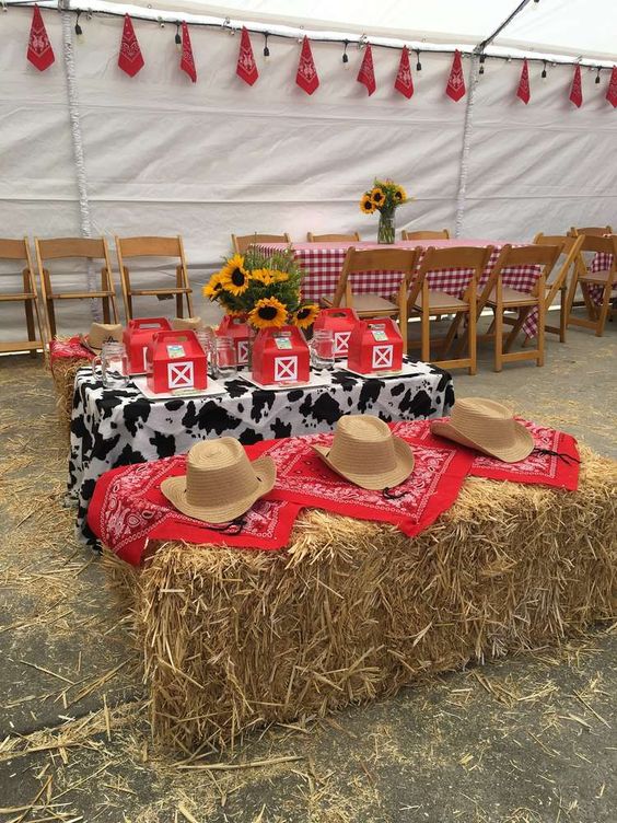 First Rodeo Birthday Party Barn Style With Hay And Table Setup