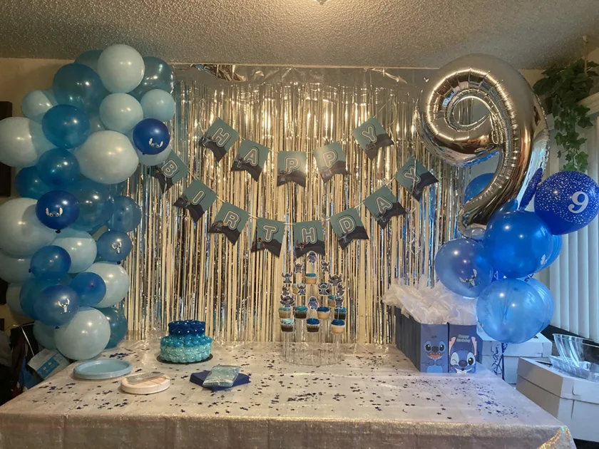 Blue Banner Silver 9 Balloon Silver Dringe Curtains Blue Balloon Arch Angle View Lilo Stitch Birthday Party