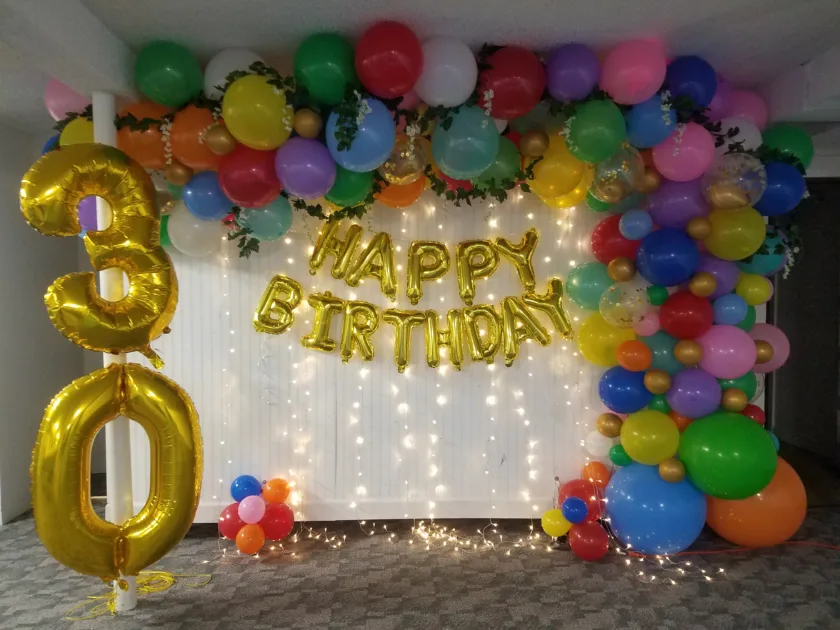 Gold Caps 30 Colorful Balloon Arch Warm Fariylights Angle View Gold Happy Birthday Balloons
